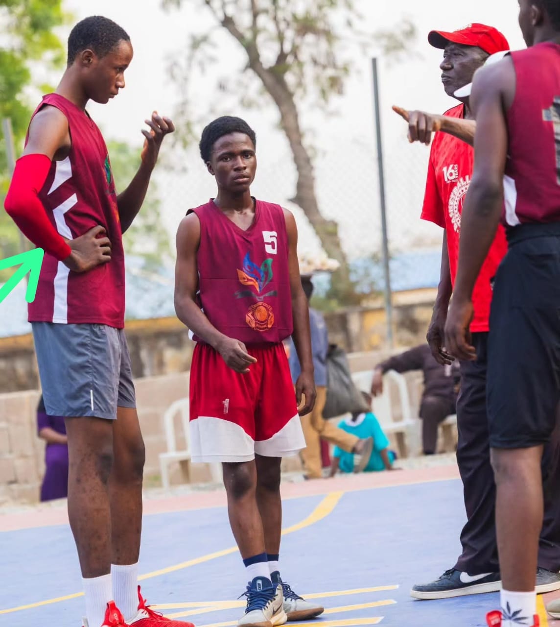 Coach giving instructions to players on the sideline at the 3X3 Championship