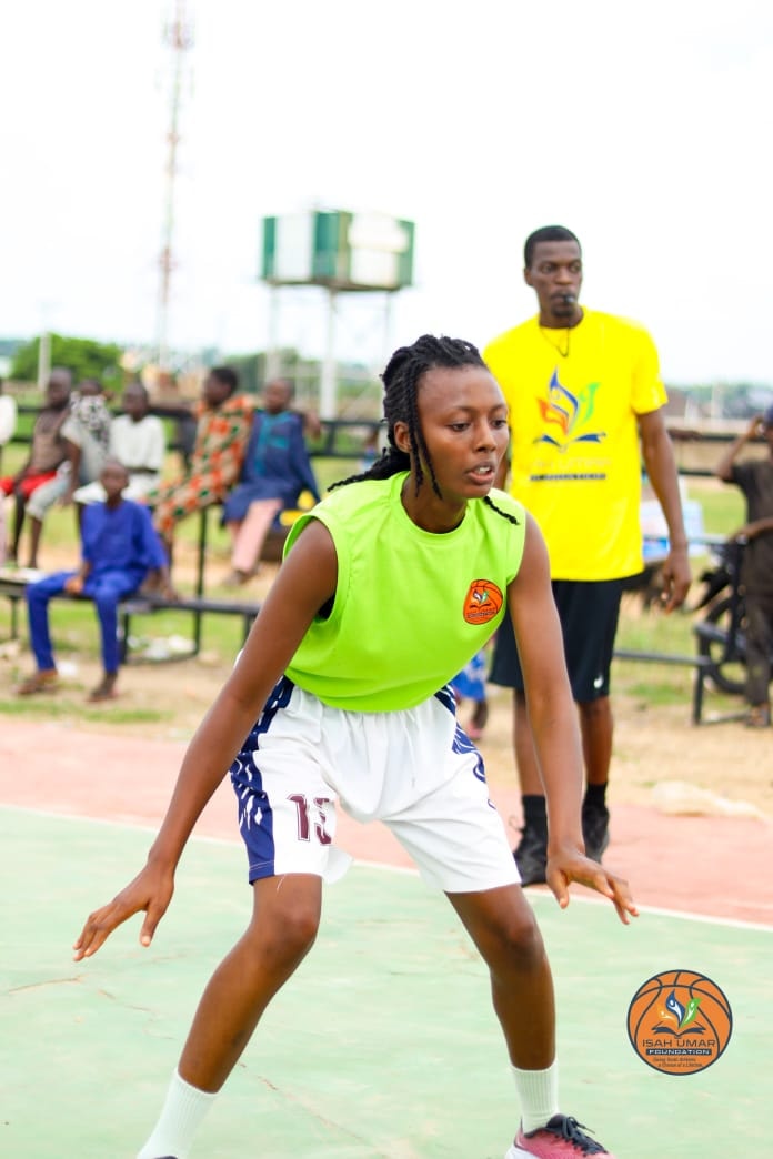Female player in defensive stance during 3X3 Championship action