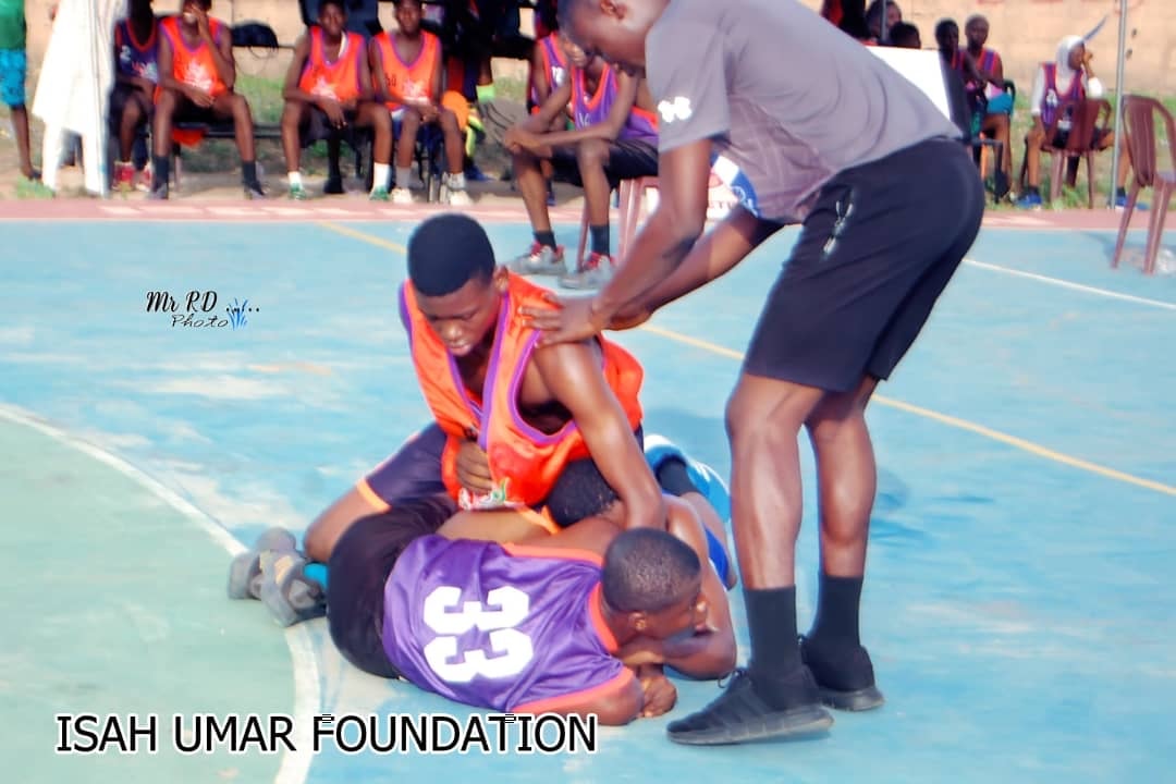 Youth celebrating together after a basketball game