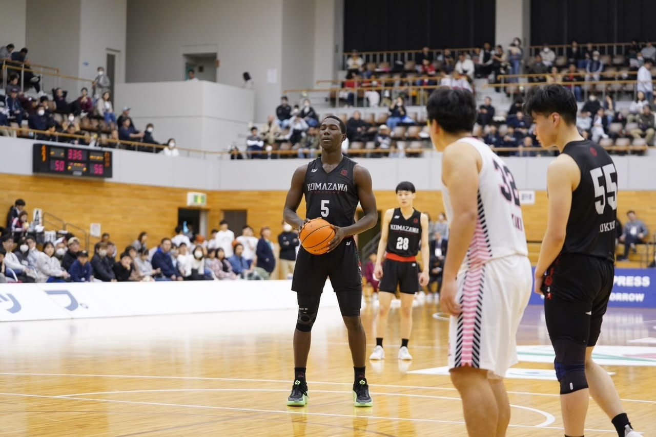 Muhammed Maude Adeyemo at the free-throw line in a packed arena in Japan