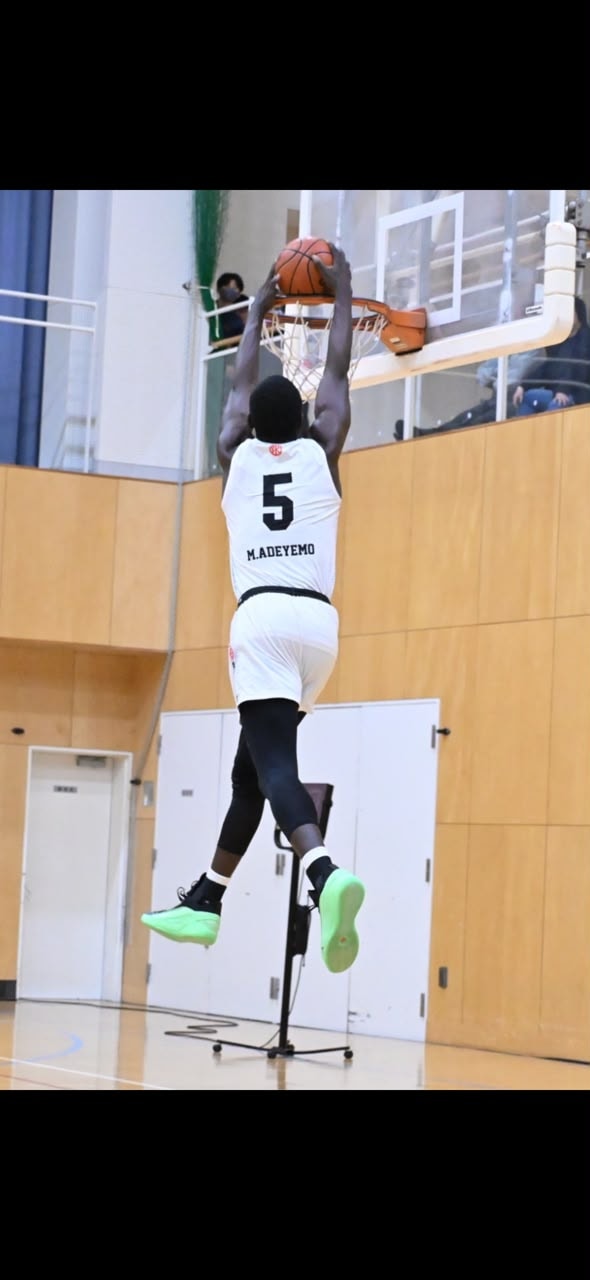 Muhammed Maude Adeyemo executing a powerful slam dunk